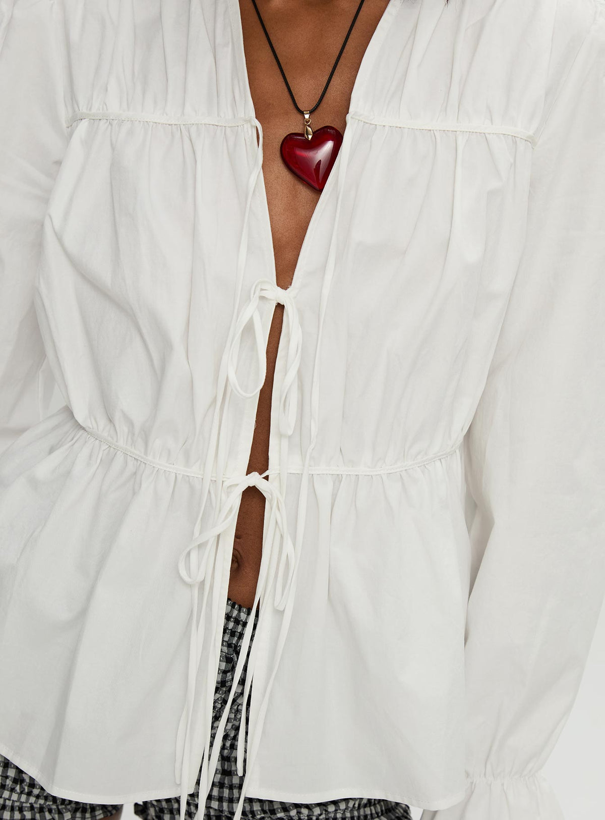 back view of model wearing Princess Polly Scarlotte Bow Tie Top White Full Sleeves V-Neck 
