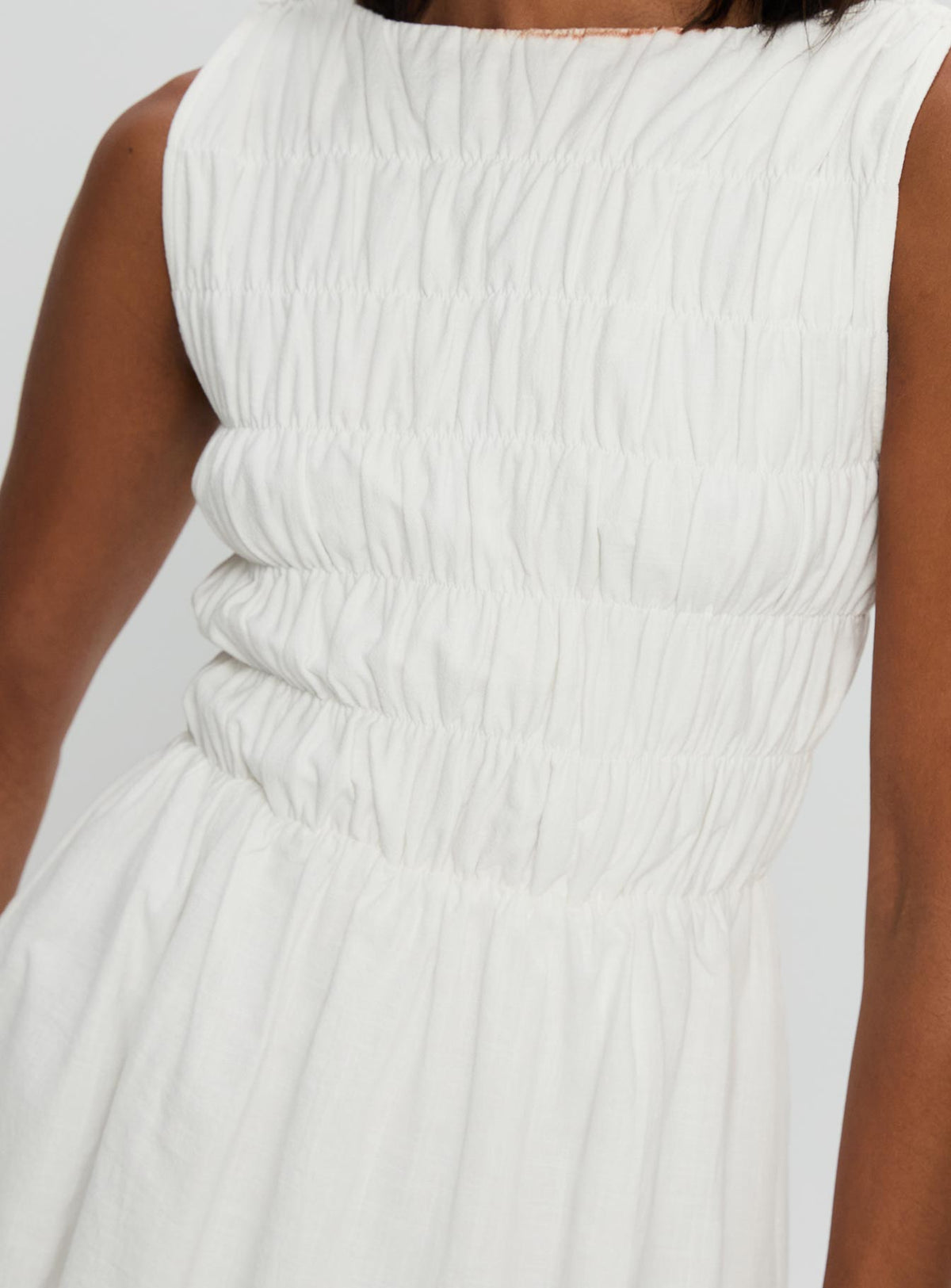 back view of model wearing Princess Polly Melona Shirred Mini Dress White Boat Neck 