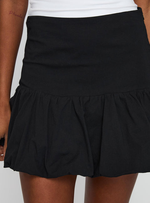 back view of model wearing Princess Polly Leilana Bubble Hem Mini Skirt Black Mini Skirts Skirts 