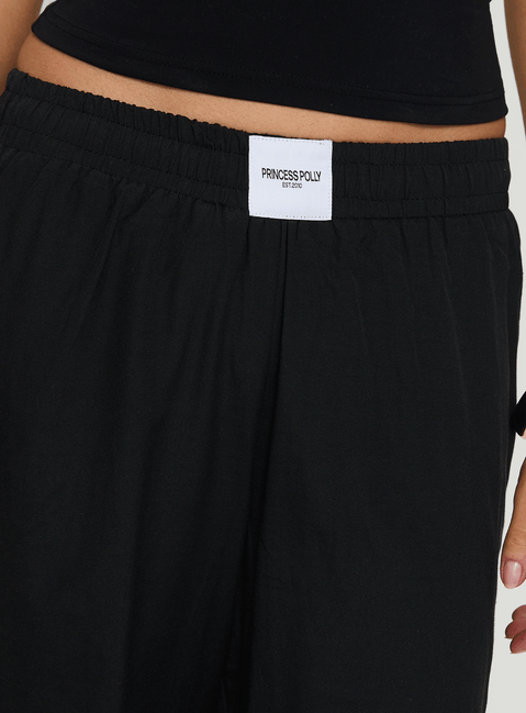 back view of model wearing Princess Polly Beach House Pants Black Low Rise Pants Pants 