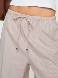 side view of model wearing Princess Polly Ogilvie Pants Beige Stripe Mid Rise Pants Pants 