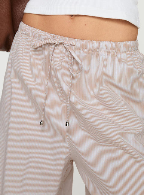 side view of model wearing Princess Polly Ogilvie Pants Beige Stripe Mid Rise Pants Pants 