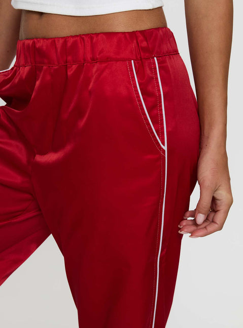back view of model wearing Princess Polly Travalta Satin Track Pant Red Low Rise Pants Pants 