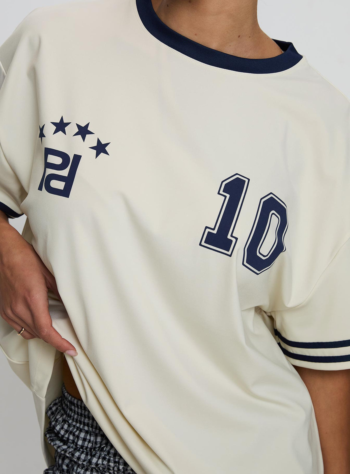back view of model wearing Princess Polly Cornwall Football Jersey Cream Half Sleeves Crew Neck 