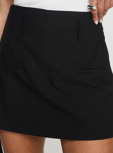back view of model wearing Princess Polly Grant My Wish Mini Skort Black High Waisted Shorts 