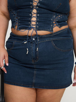 back view of model wearing Princess Polly Popular Low Rise Mini Skirt Mid Blue Wash Curve Mini Skirts Skirts 