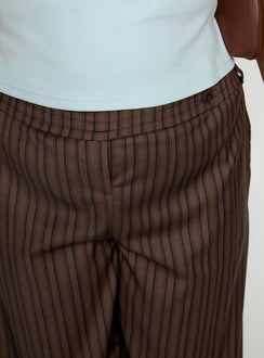 side view of model wearing Princess Polly Cedars Low Rise Pant Brown Stripe Curve Low Rise Pants Pants 
