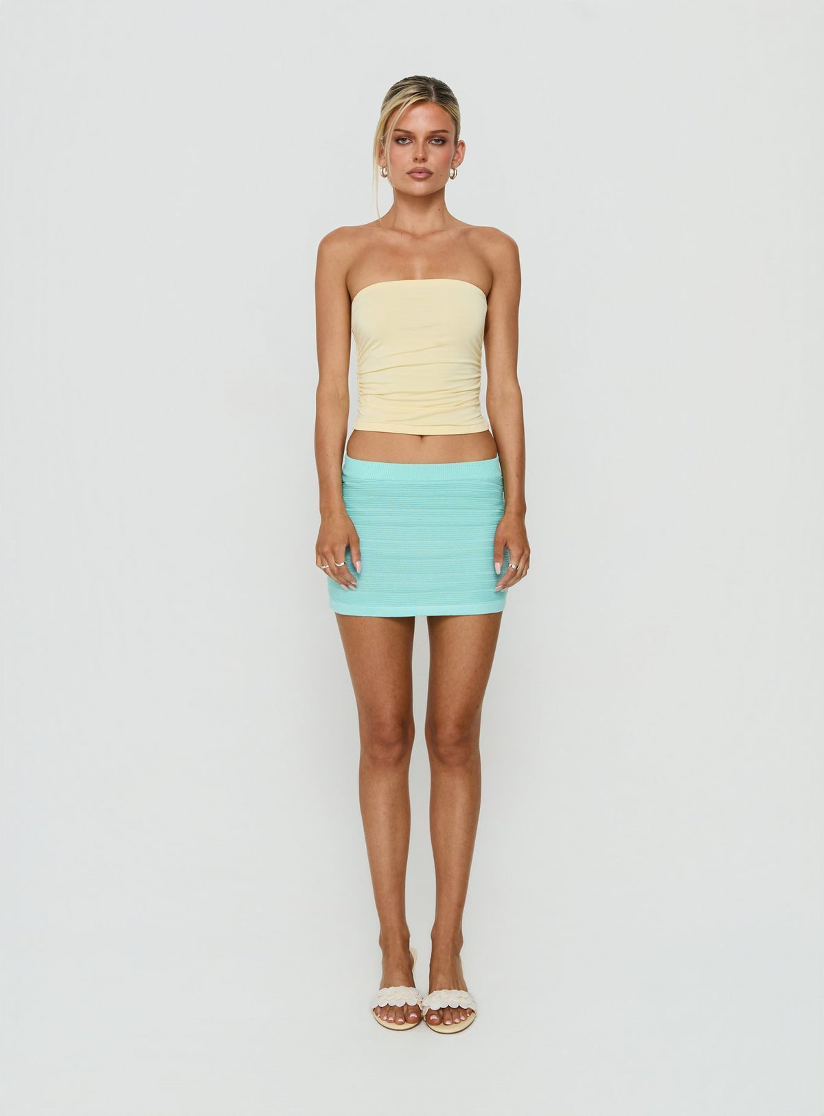 Featuring the Qwin Knit Mini Skirt in Aqua womens-skirts with mini length front view of model wearing Princess Polly