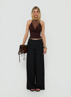 Showcasing the Archer Mid Rise Baggy Pants Black in womens-regular-pants with pleated details front view of model wearing Princess Polly