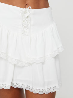 back view of model wearing Princess Polly Capshaw Mini Skirt White Mini Skirts Skirts 