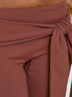 Highlighting the Daily Define Tie Waist Pants Brown in womens regular pants with high-rise and wide-leg styling detail view of model wearing Princess Polly