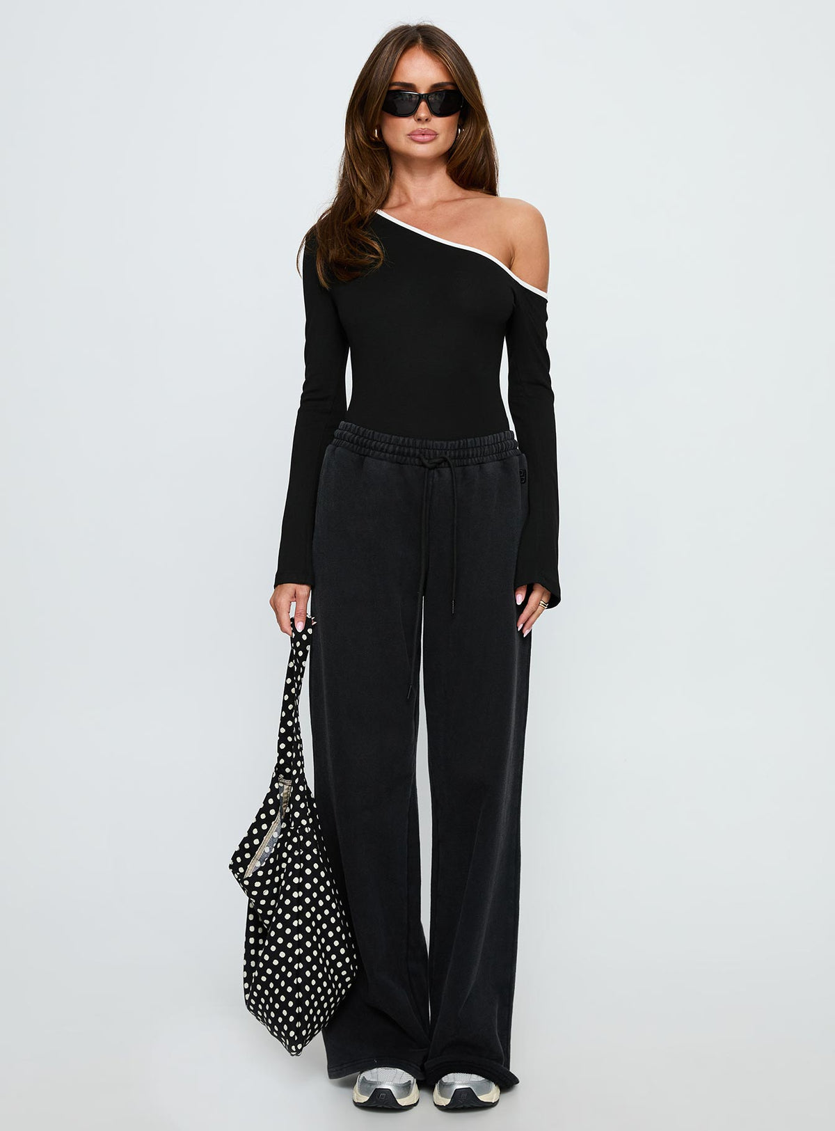 front view of model wearing Princess Polly Andrielle One Shoulder Long Sleeve Bodysuit Black / White Long Sleeve Tops Bodysuit 