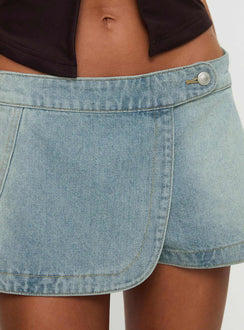 back view of model wearing Princess Polly Down For The Ride Denim Skort Light Wash Low Rise Shorts 