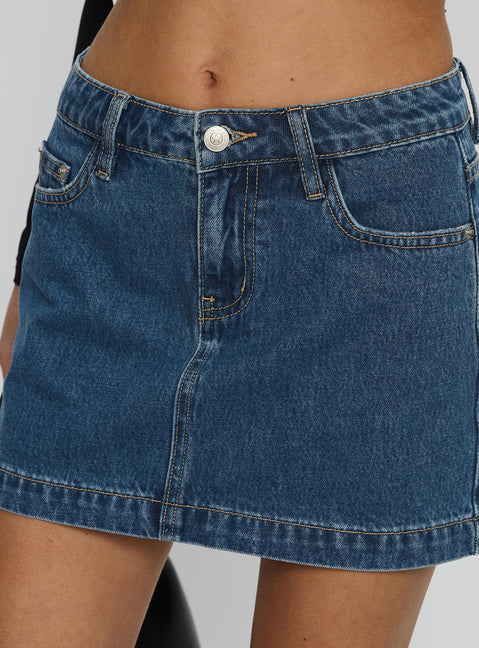  side view of model wearing Princess Polly Nickei Denim Mini Skirt Mid Wash Tall Mini Skirts Skirts 