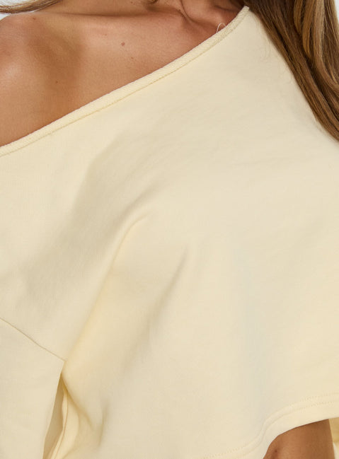 Showcasing the Retreat Raw Edge Off Shoulder Jumper Buttercream womens-jumpers with short length front view of model wearing Princess Polly