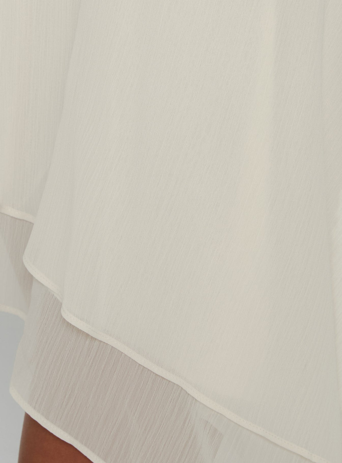 Presenting the Gemmina Asymmetrical Chiffon Mini Skirt Cream womens-skirts in relaxed fit with mini length Princess Polly
