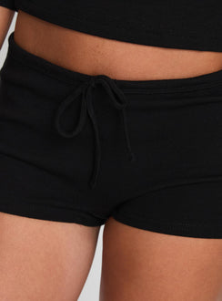 back view of model wearing Princess Polly Gracious Low Rise Mini Short Black Low Rise Shorts 