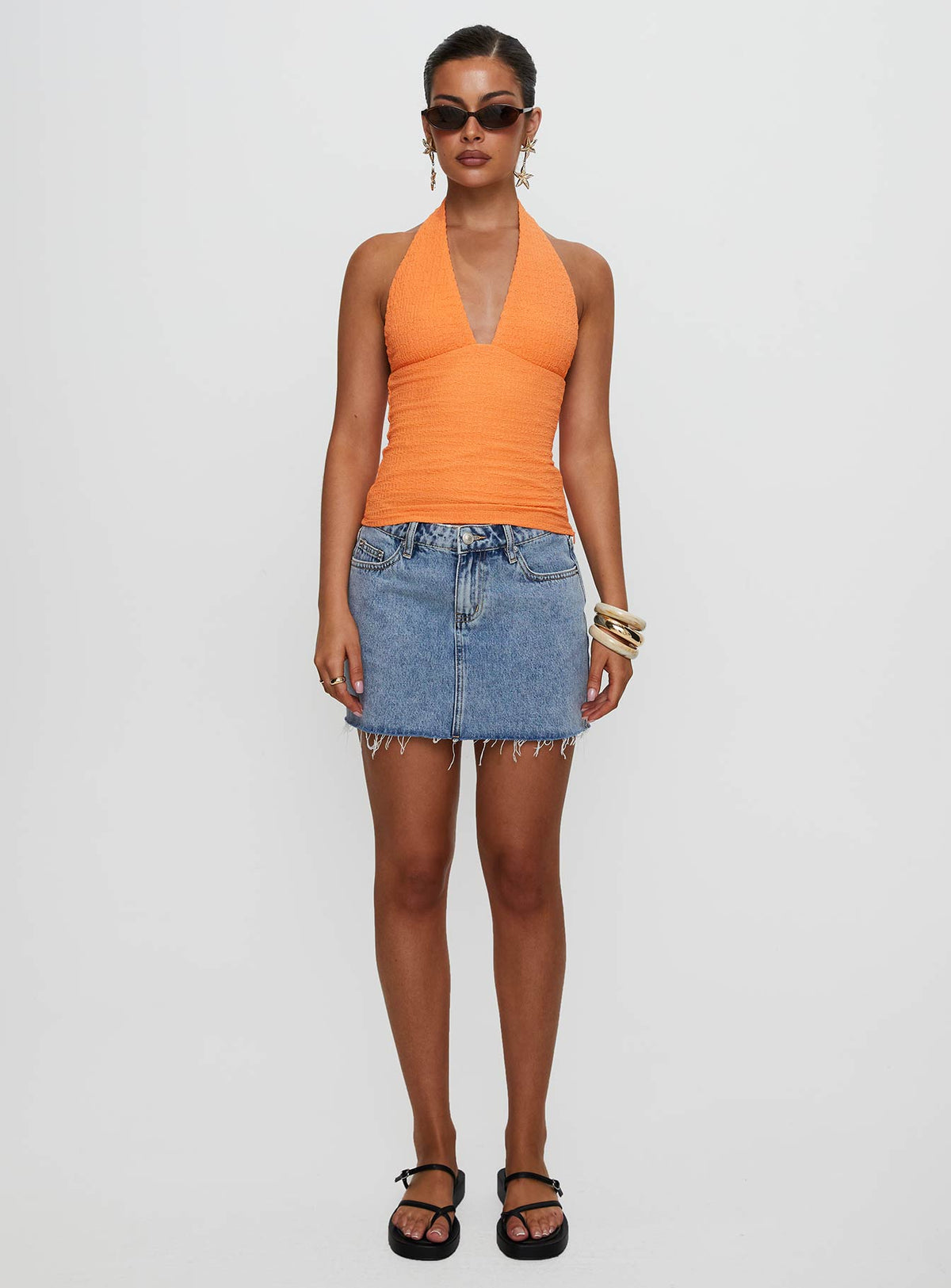 front view of model wearing Princess Polly Emaline Halter Top Orange Sleeveless Plunger 