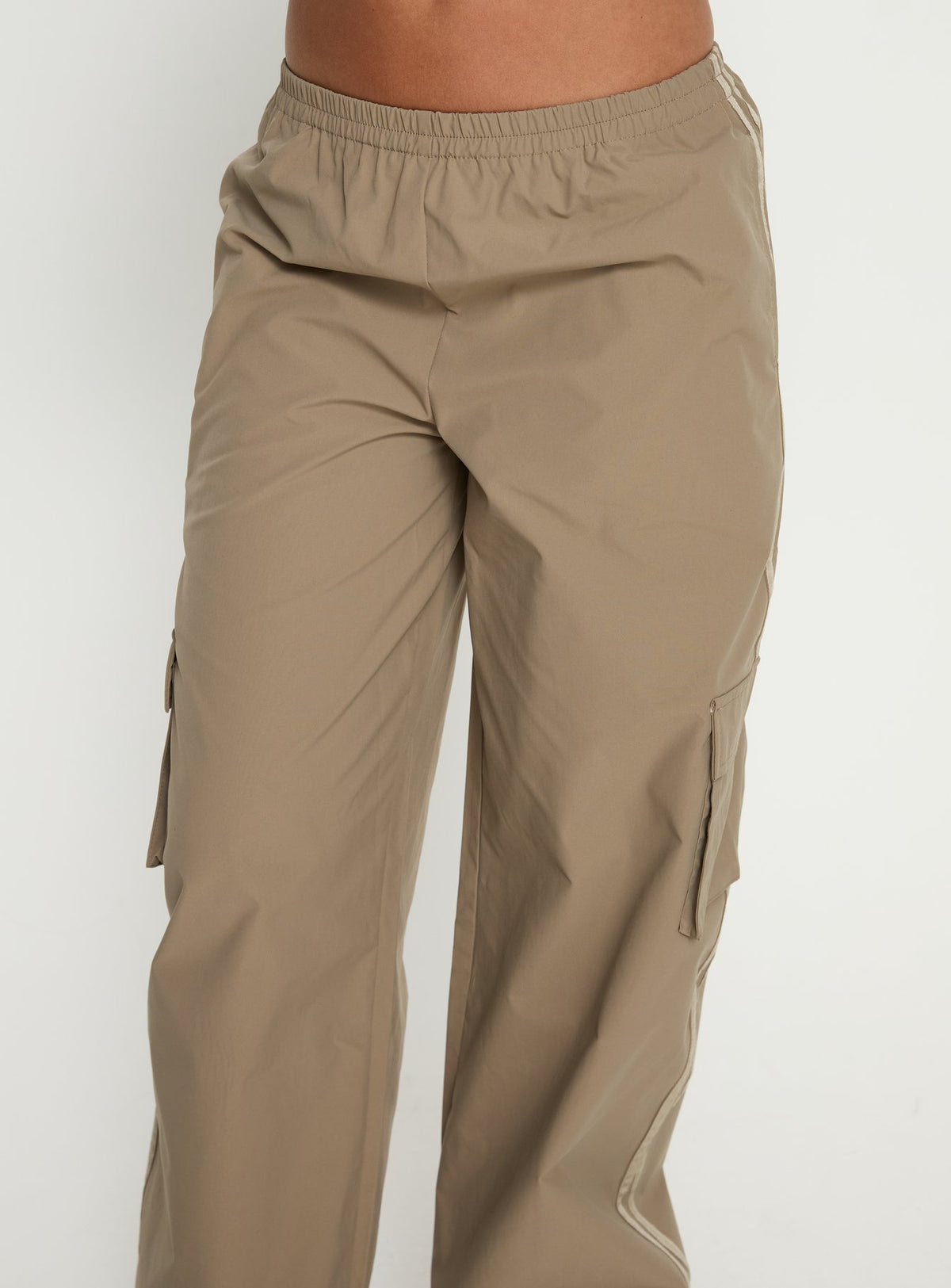 side view of model wearing Princess Polly Ellyn Baggy Cargo Pants Khaki Mid Rise Pants Pants 