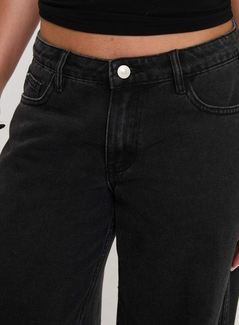 back view of model wearing Princess Polly Ramos Low Rise Denim Jeans Washed Black Tall Mid Rise 