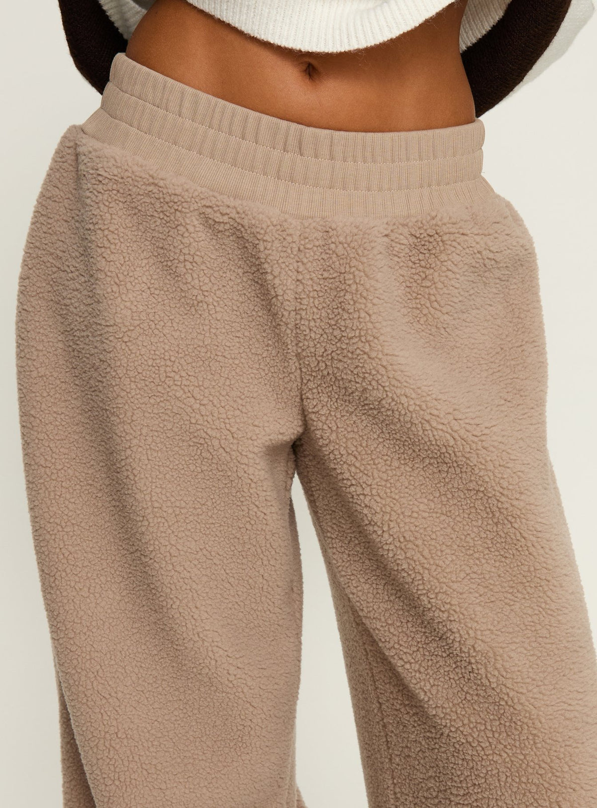 back view of model wearing Princess Polly Siberia Fleece Track Pant Light Brown High Rise Pants Pants 