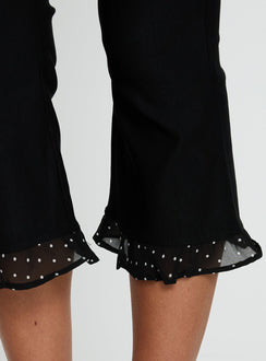 back view of model wearing Princess Polly Darsie Frill Capri Black Polka Dot High Rise Pants Pants 