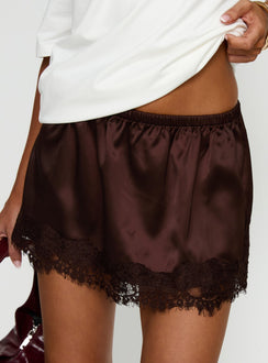   side view of model wearing Princess Polly Orlynn Satin Lace Trim Mini Skirt Brown Mini Skirts Skirts 