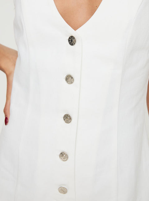 Romper Fixed shoulder straps, scooped neckline, button fastening down front Non-stretch material, unlined 