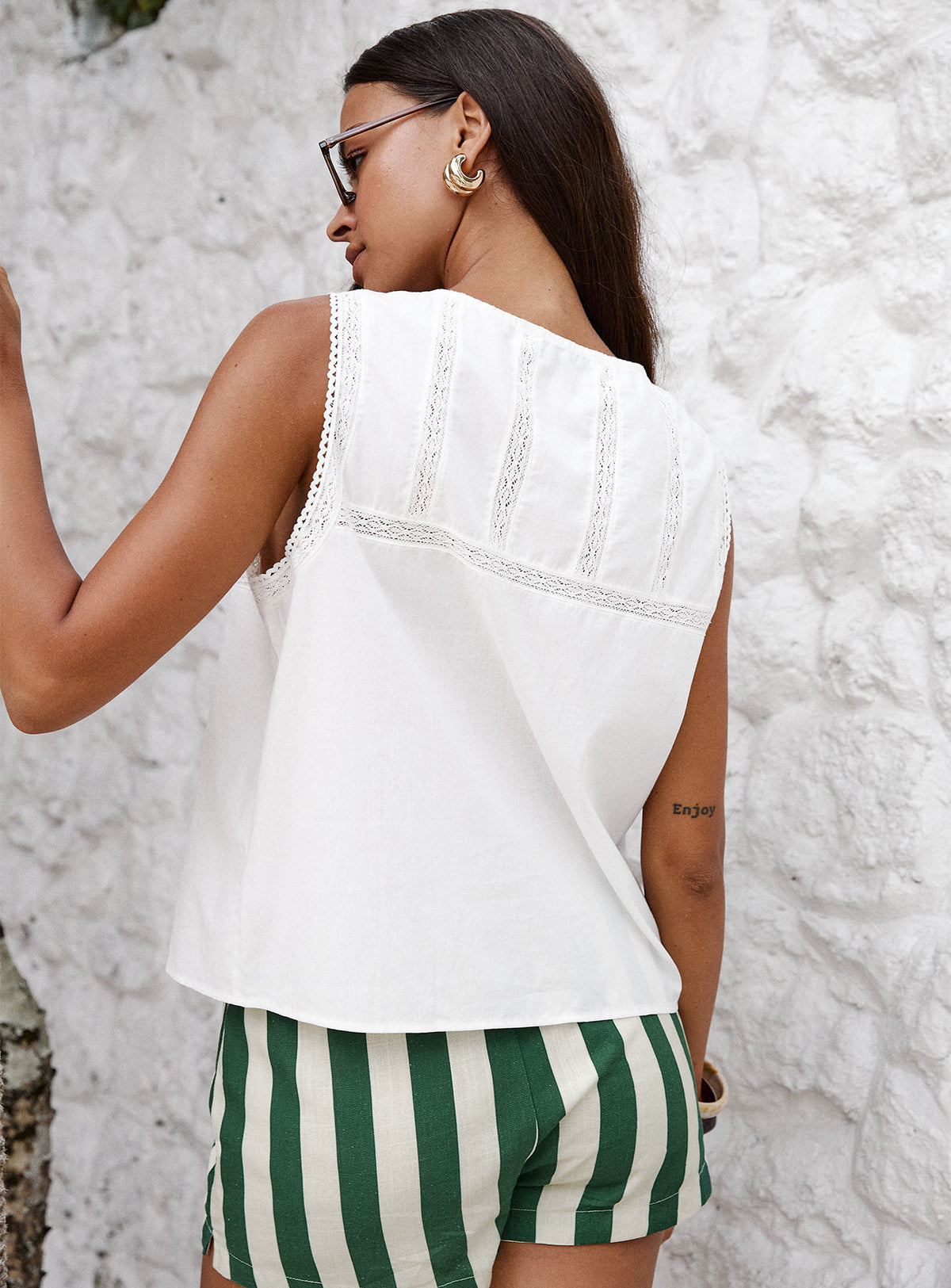 back view of model wearing Princess Polly Angourie Blouse Top White Sleeveless Crew Neck 