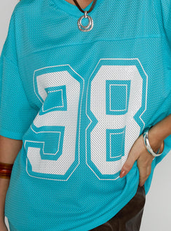 back view of model wearing Princess Polly 98 Sports Graphic Top Blue Half Sleeves V-Neck 