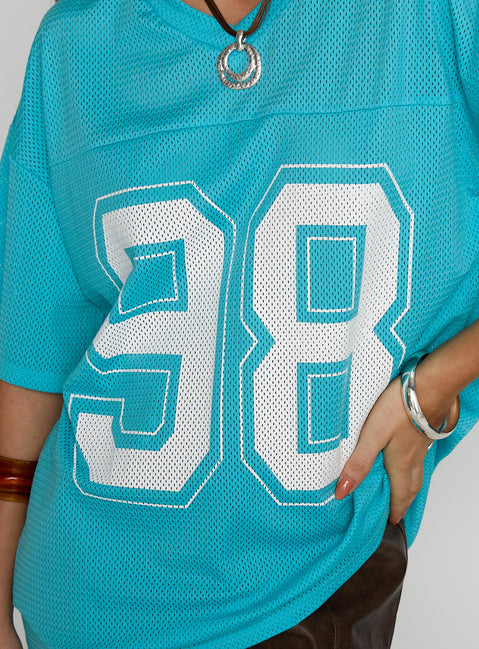 back view of model wearing Princess Polly 98 Sports Graphic Top Blue Half Sleeves V-Neck 