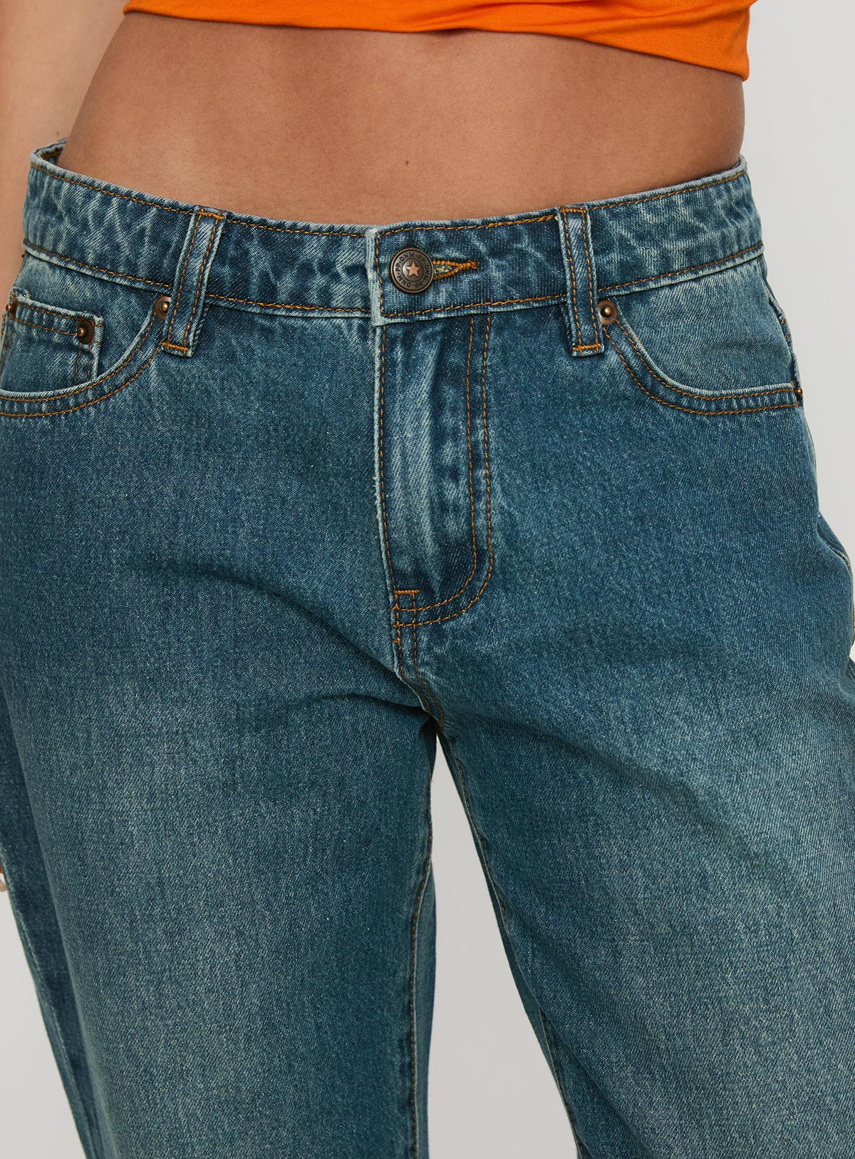 side view of model wearing Princess Polly Toros Mid Rise Wide Leg Foldover Denim Jeans Mid Blue Low Rise Jeans Jeans 