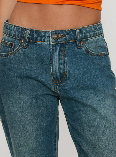 side view of model wearing Princess Polly Toros Mid Rise Wide Leg Foldover Denim Jeans Mid Blue Low Rise Jeans Jeans 