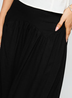 back view of model wearing Princess Polly Human Nurture Maxi Skirt Black Maxi Skirts Skirts 