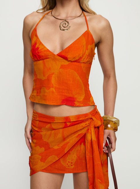 back view of model wearing Princess Polly Quintana Wrap Mini Skirt Orange Floral Skirts 