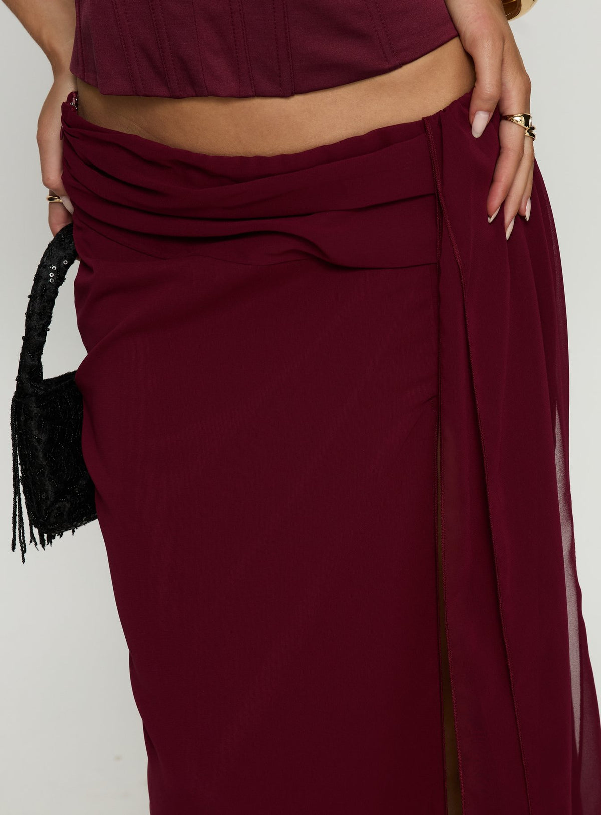 back view of model wearing Princess Polly Hollian Draped Maxi Skirt Wine Maxi Skirts Skirts 