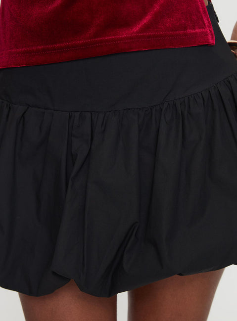 back view of model wearing Princess Polly Marentino Bubble Hem Mini Skirt Black Mini Skirts Skirts 