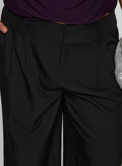 side view of model wearing Princess Polly Two Lovers Low Rise Pants Black Curve Low Rise Pants Pants 