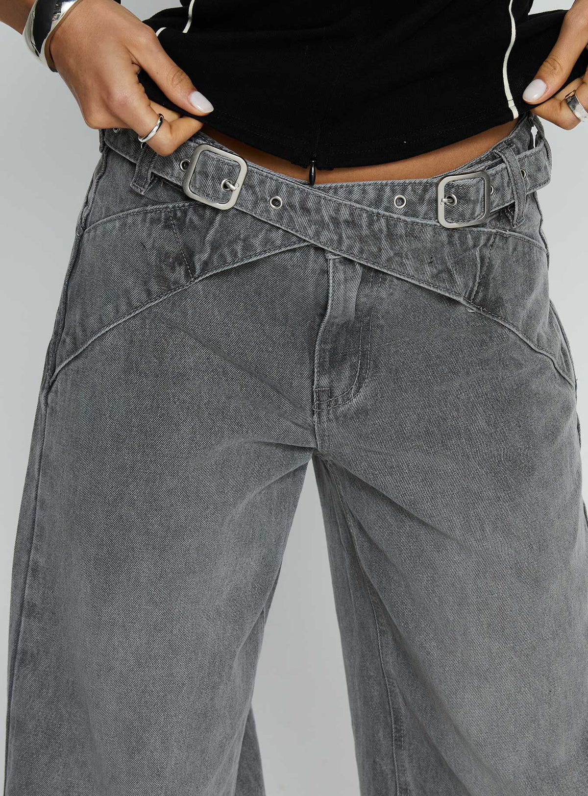 back view of model wearing Princess Polly Mckinley Mid Rise Wide Leg Jeans Washed Grey Mid Rise Jeans 