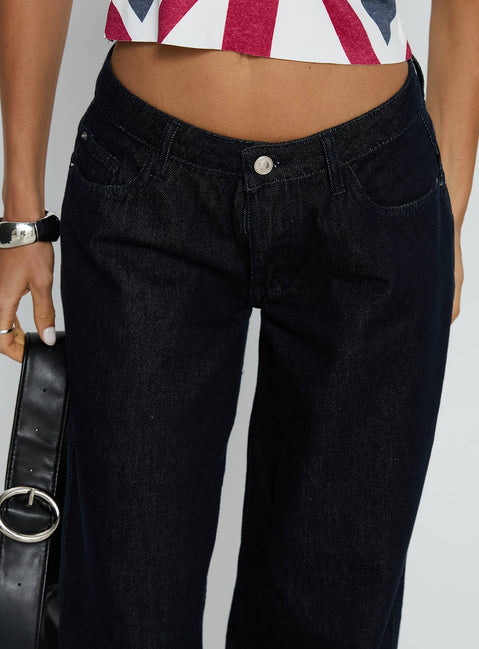 back view of model wearing Princess Polly Ramos Low Rise Wide Leg Jeans Raw Indigo Blue Low Rise Jeans Jeans 