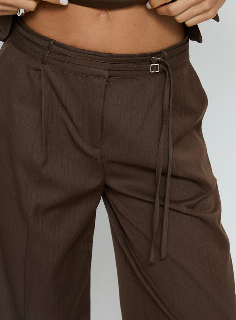 front view of model wearing Princess Polly Natilee Relaxed Tailored Pants Brown Pinstripe Low Rise Pants Pants 