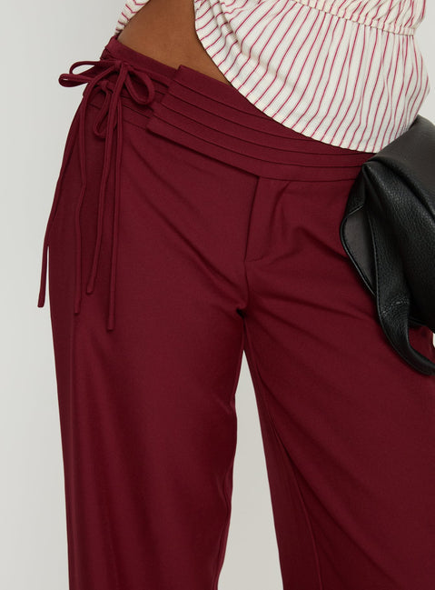 back view of model wearing Princess Polly Good Riddance Pleat Tie Slouch Pants Burgundy Mid Rise Pants Pants 