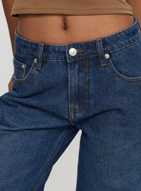 back view of model wearing Princess Polly Everlong Mid Rise Wide Leg Jeans Dark Blue Wash Mid Rise Jeans Jeans 