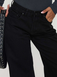 back view of model wearing Princess Polly Colemane Mid Rise Wide Leg Jeans Black High Rise Jeans Jeans 