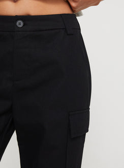 back view of model wearing Princess Polly Raider Low Waist Cargo Pant Black High Rise Pants Pants 