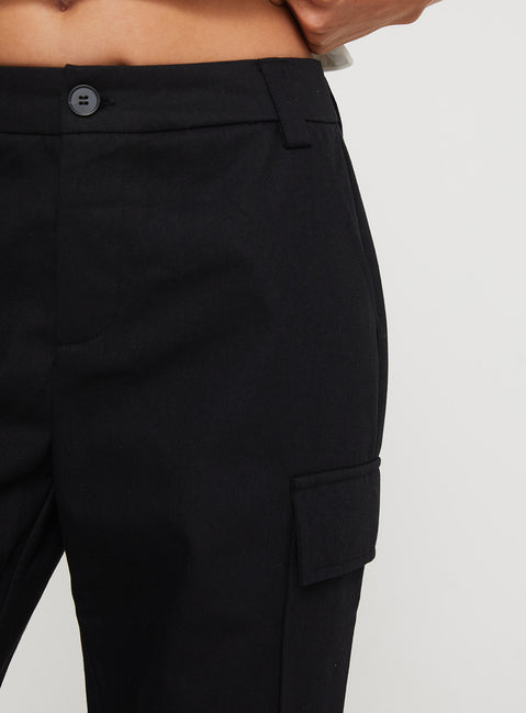 back view of model wearing Princess Polly Raider Low Waist Cargo Pant Black High Rise Pants Pants 