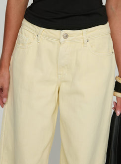 back view of model wearing Princess Polly Ramos Low Rise Wide Leg Denim Jeans Butter Lemon Low Rise Jeans Jeans 