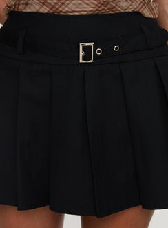 back view of model wearing Princess Polly Sydnea Pleat Mini Skirt Black Mini Skirts Skirts 
