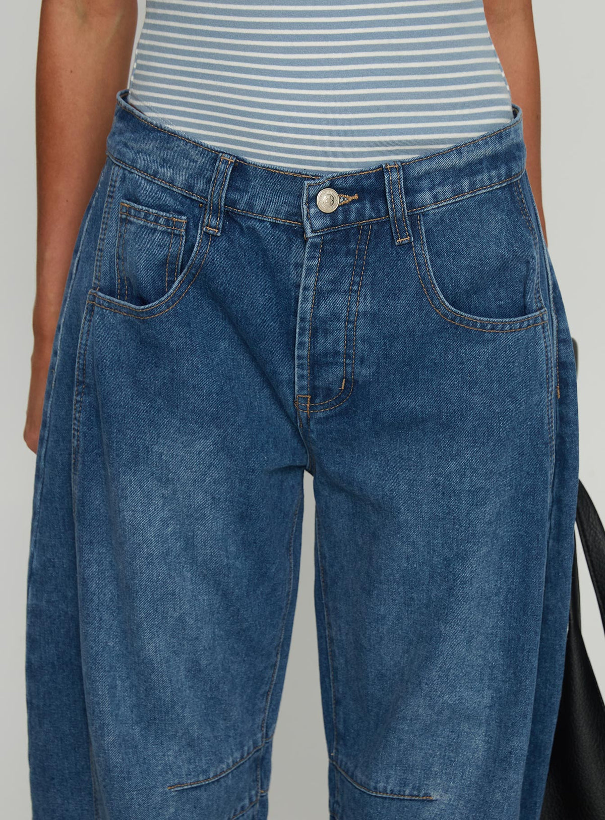 back view of model wearing Princess Polly Normana Mid Rise Cropped Barrel Jeans Mid Blue Wash Mid Rise Jeans 