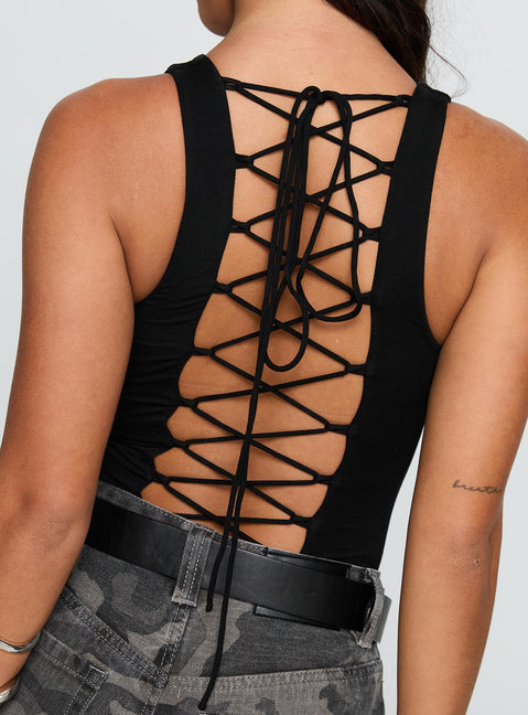 side view of model wearing Princess Polly Majesty Tie Back Bodysuit Black Sleeveless Bodysuit 